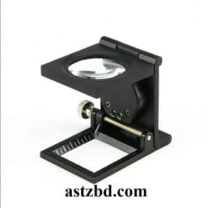 Thread Counting Glass 10X Linen Tester Magnifier placed on woven fabric showing thread count grid